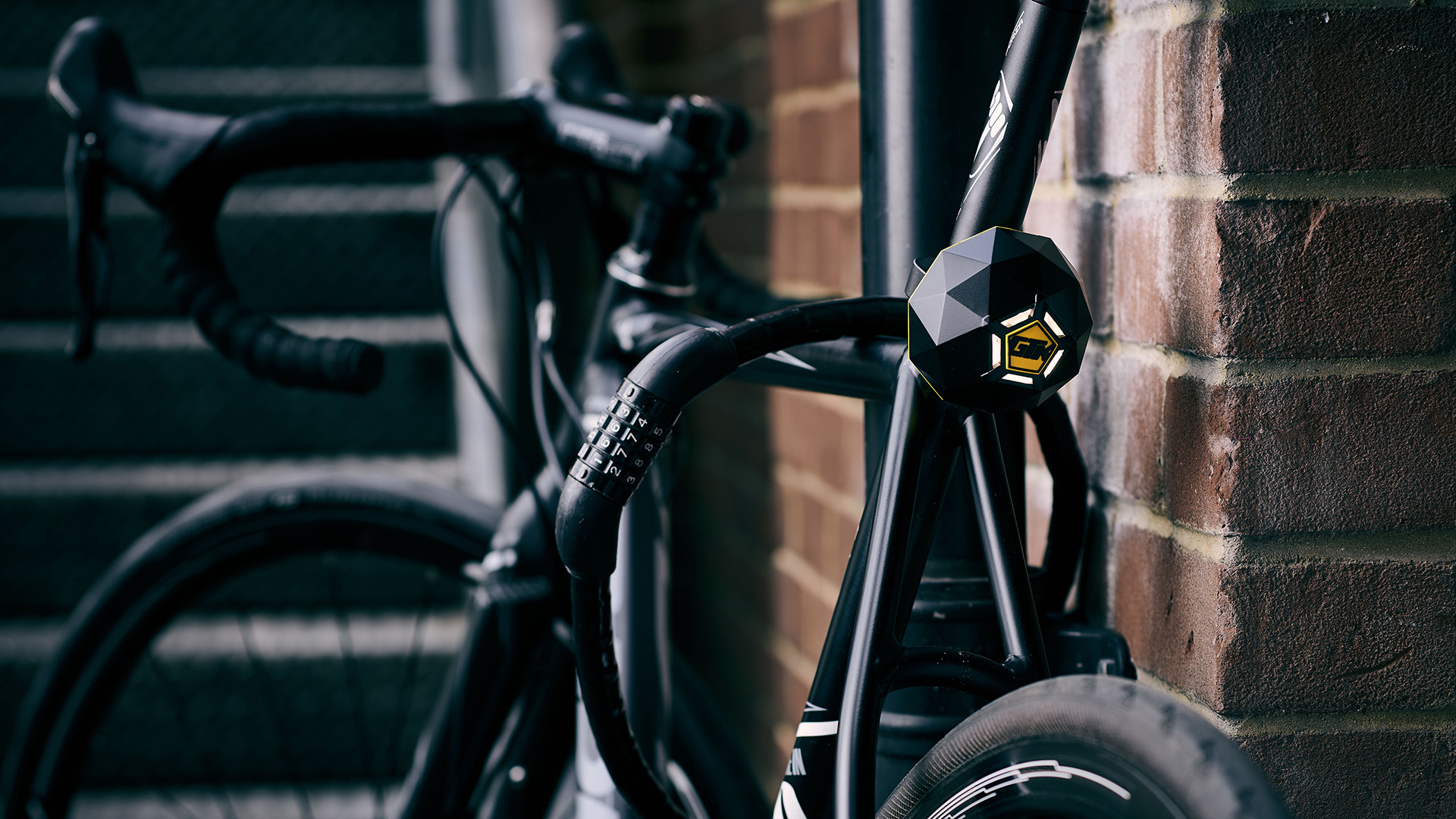 Road bike parked with lock and Limpet smart alarm